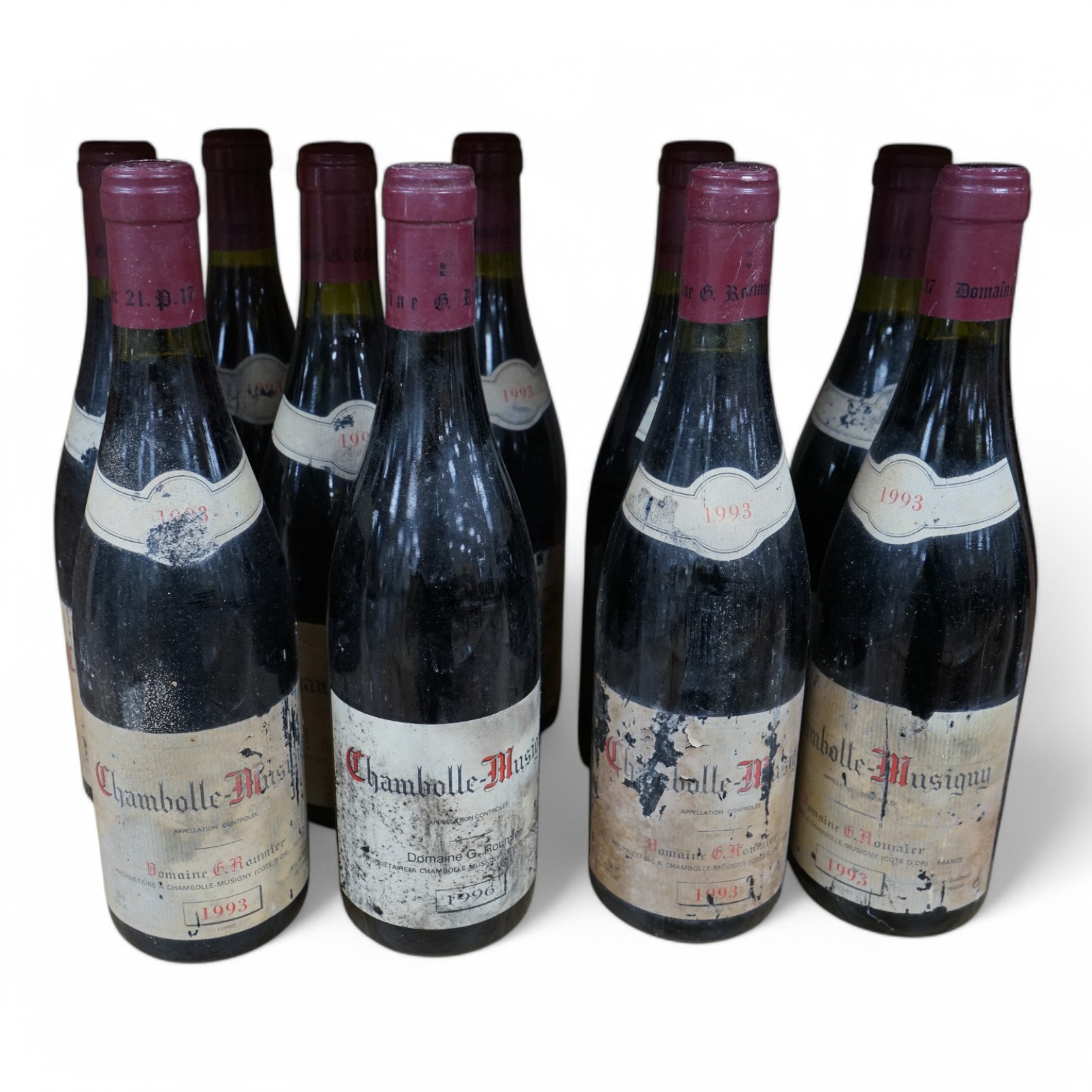 Ten bottles of Georges Roumier Chambolle-Musigny comprising nine bottles, 1993 and one 1996. Condition - fair, labels disintegrated, from a local private cellar